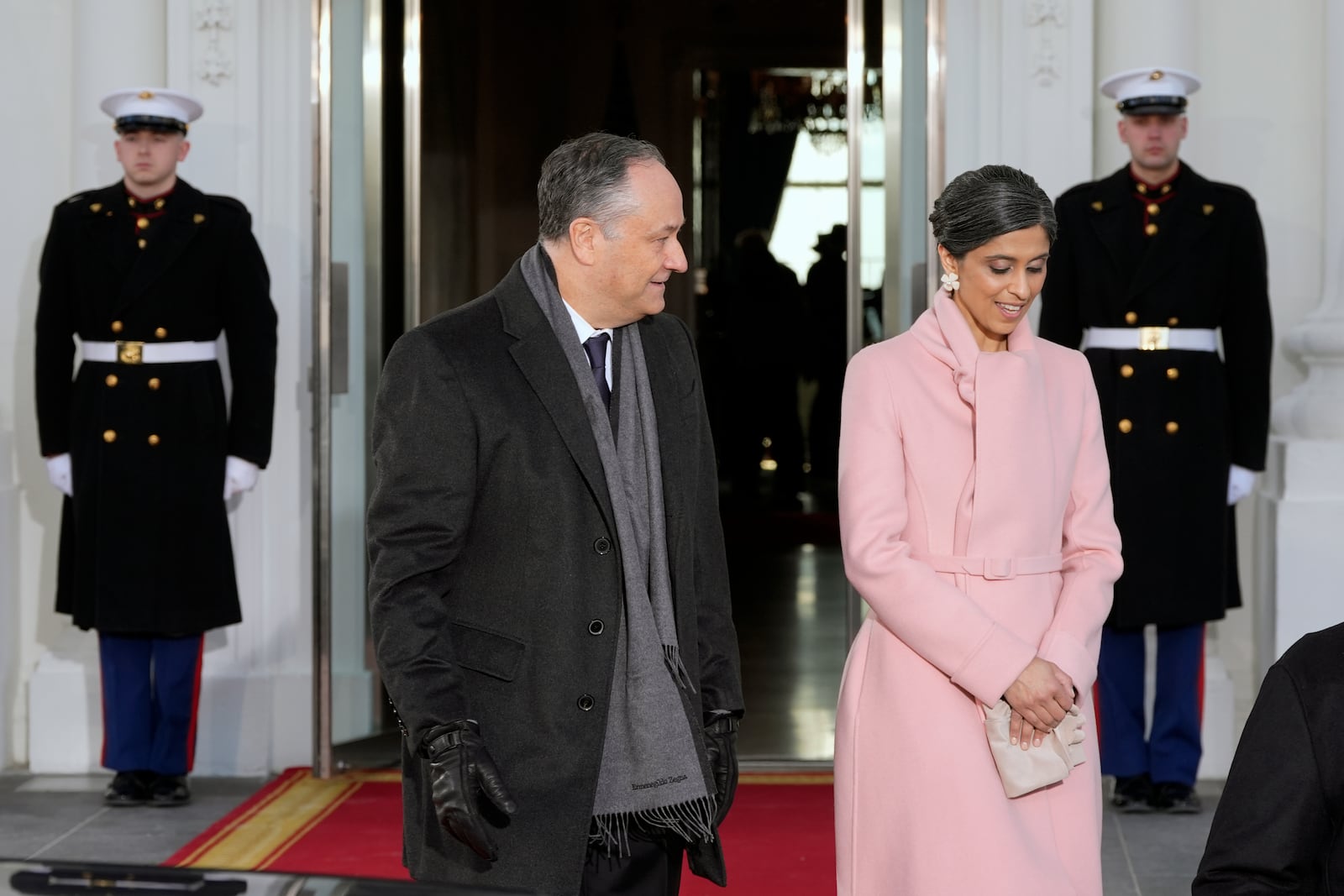 Second gentleman Doug Emhoff and Usha Vance, walk out to move into their motorcade cars after meeting at the White House, Monday, Jan. 20, 2025, in Washington. (AP Photo/Alex Brandon)