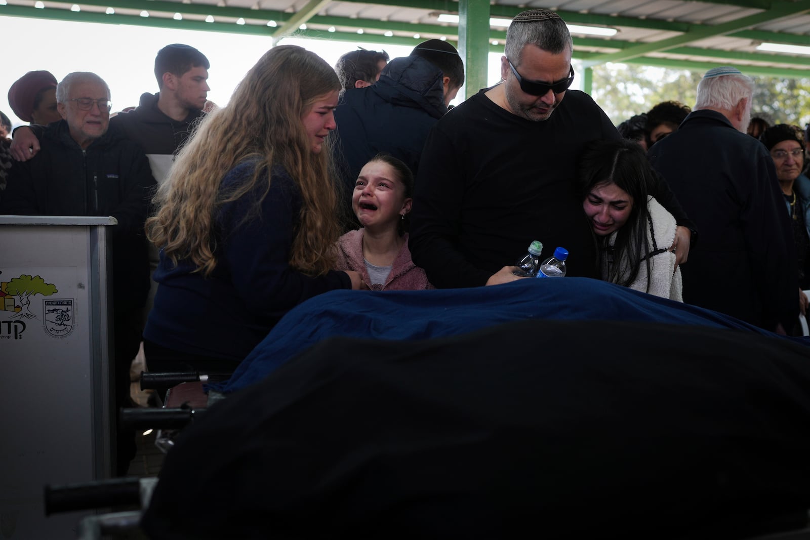 Mourners attend the funeral of Rachel Cohen, 73, and Aliza Raiz, 70, who were killed yesterday in a Palestinian shooting attack in the West Bank, at a cemetery in the West Bank Jewish settlement of Kdumim, Tuesday, Jan. 7, 2025. (AP Photo/Ohad Zwigenberg)