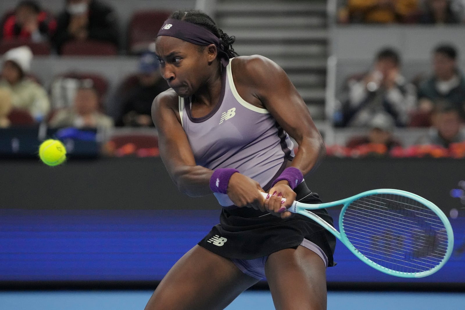 FILE - Coco Gauff of the United States returns the ball to Naomi Osaka of Japan in in a women's singles match for the China Open tennis tournament held at the National Tennis Center in Beijing, Tuesday, Oct. 1, 2024. (AP Photo/Achmad Ibrahim, File)