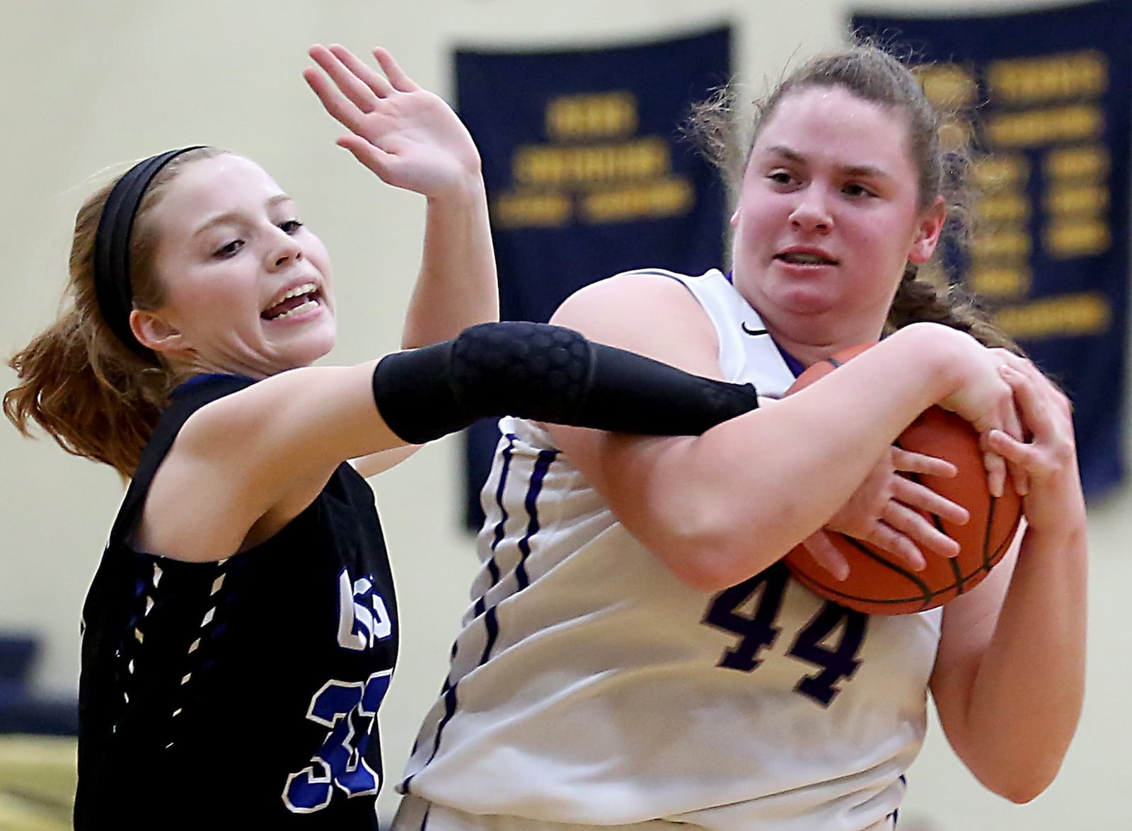 Cincinnati Christian guard Allie Statzer fouls Miami Valley Christian Academy center Dawsyn Vilardo during their Division IV sectional game at Monroe on Tuesday night. CONTRIBUTED PHOTO BY E.L. HUBBARD