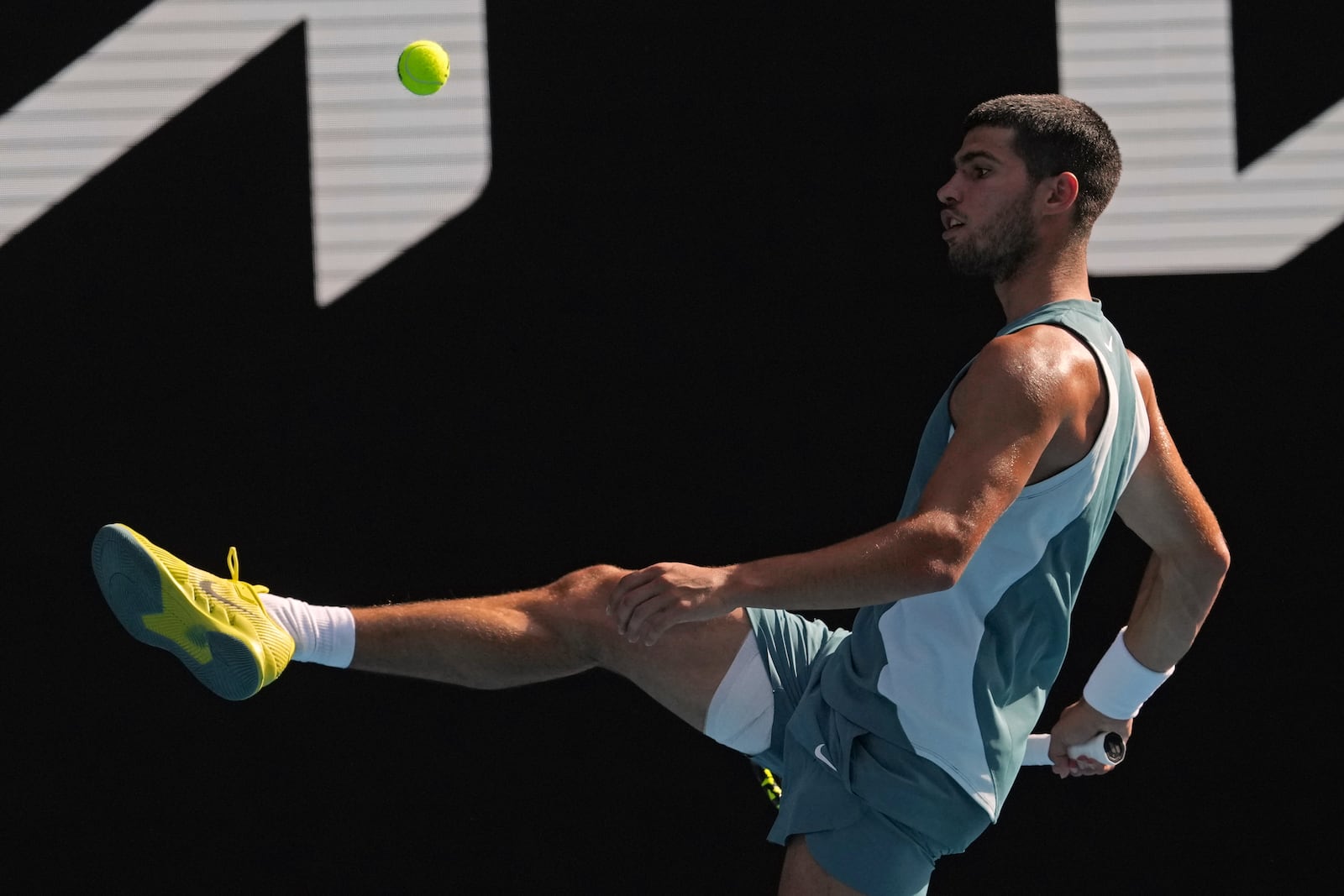 Carlos Alcaraz of Spain kicks the ball during a fourth round match against Jack Draper of Britain at the Australian Open tennis championship in Melbourne, Australia, Sunday, Jan. 19, 2025. (AP Photo/Mark Baker)