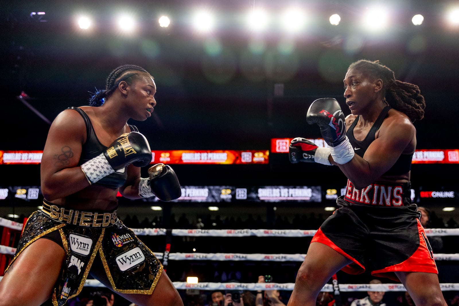 Claressa Shields, left, fights with Danielle Perkins during the undisputed heavyweight title match on Sunday, Feb. 2, 2025 at Dort Financial Center in Flint. (Jake May/The Flint Journal via AP)