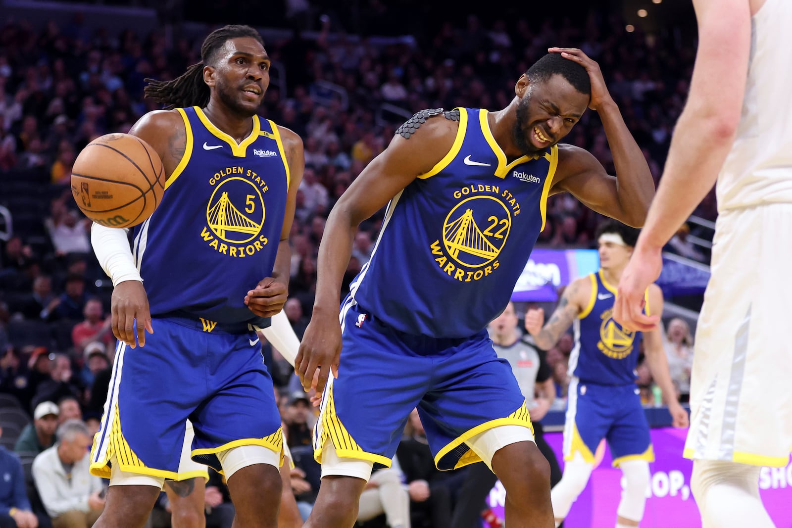 Golden State Warriors' Andrew Wiggins (22) reacts to being fouled after a basket against the Utah Jazz during the second half of an NBA basketball game in San Francisco on Tuesday, Jan. 28, 2025. (Scott Strazzante/San Francisco Chronicle via AP)