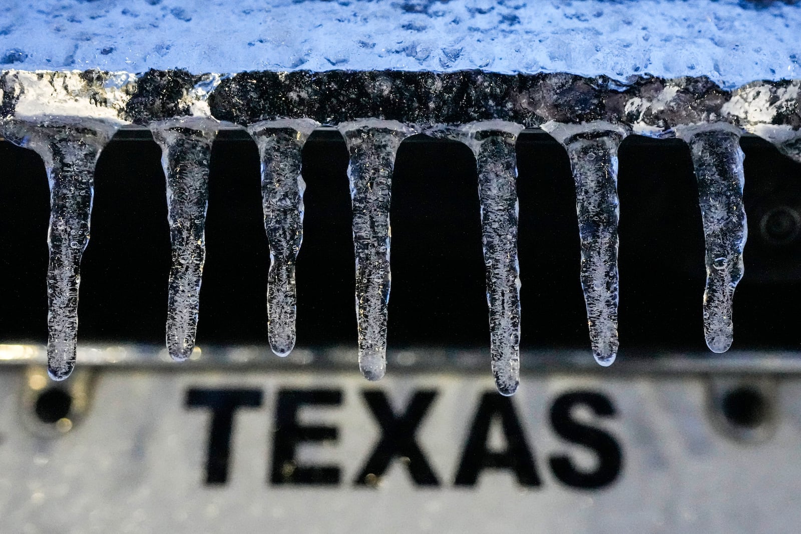 Icicles hang down from a vehicle during an icy winter storm in Galveston, Texas, Tuesday, Jan. 21, 2025. (Brett Coomer/Houston Chronicle via AP)