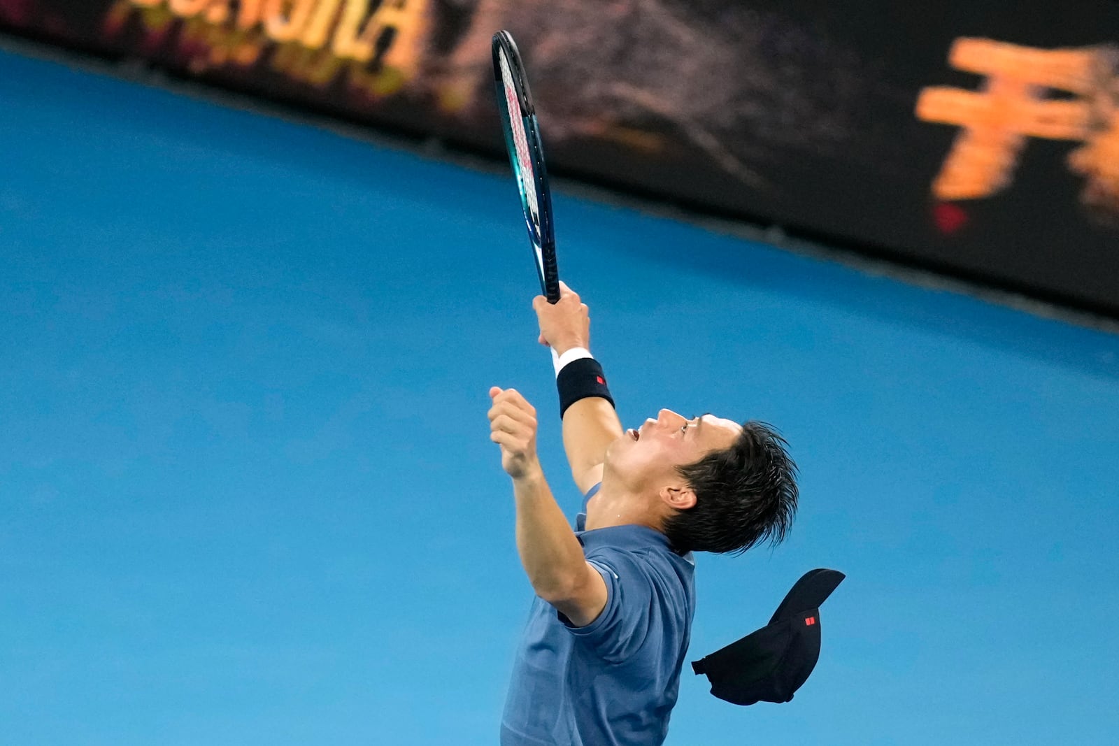 Kei Nishikori of Japan reacts after defeating Thiago Monteiro of Brazil during their first round match at the Australian Open tennis championship in Melbourne, Australia, Sunday, Jan. 12, 2025.(AP Photo/Asanka Brendon Ratnayake)