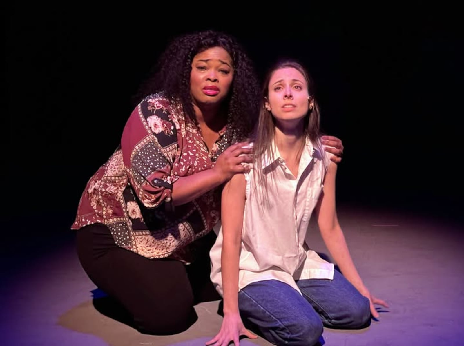 Dwan Hayes (Oda Mae Brown) and Charmien Byrd (Molly Jensen) in La Comedia Dinner Theatre's production of "Ghost: The Musical." PHOTO BY JUSTIN WALTON