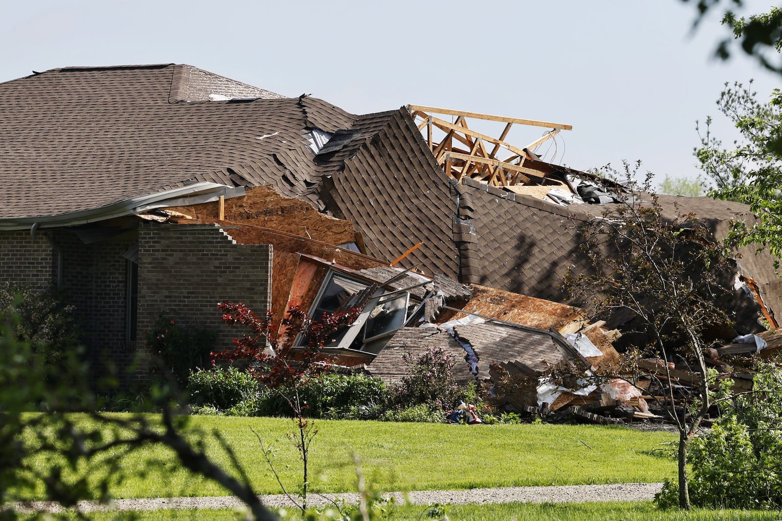 Damage from a suspected tornado from Tuesday, May 7, 2024, is shown in these images from Wednesday morning along Bunker Hill Woods Road in Reily Twp. in Butler County. NICK GRAHAM/STAFF