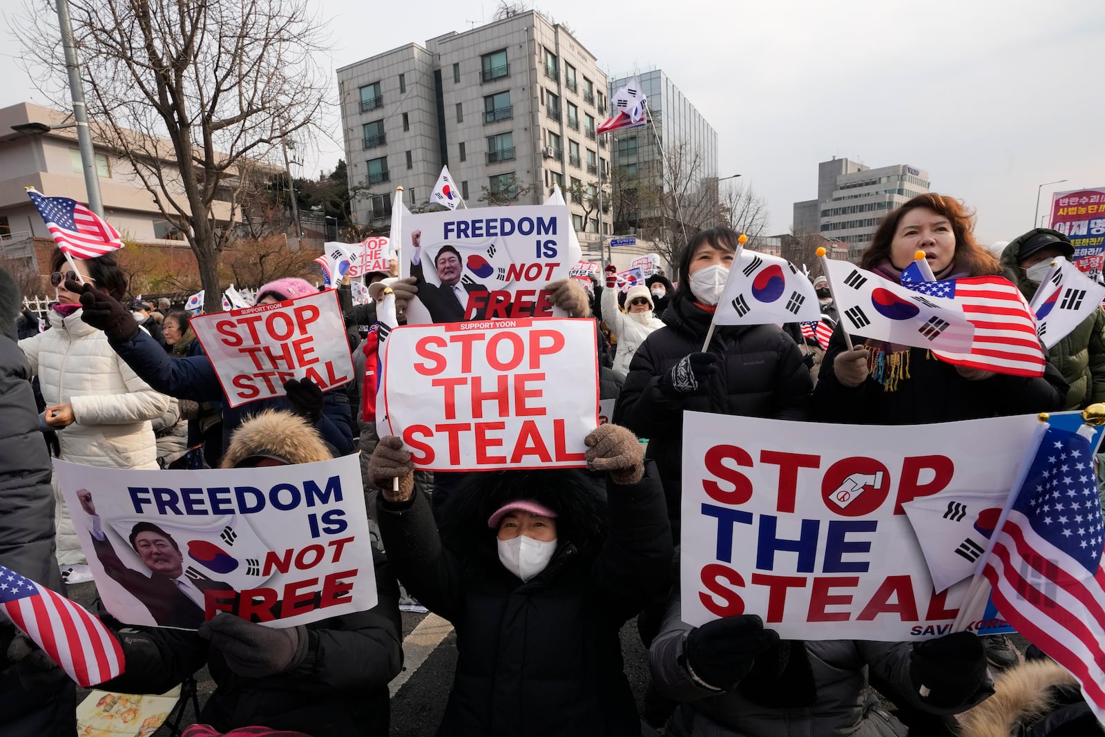 Supporters of impeached South Korean President Yoon Suk Yeol attend a rally to oppose his impeachment near the presidential residence in Seoul, South Korea, Wednesday, Jan. 8, 2025. (AP Photo/Ahn Young-joon)