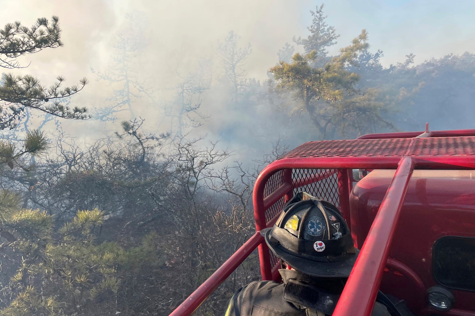 Firefighters respond to a brush fire in Suffolk County in New York's Long Island on Saturday, March 8, 2025. (Steve Pfost/Newsday via AP)