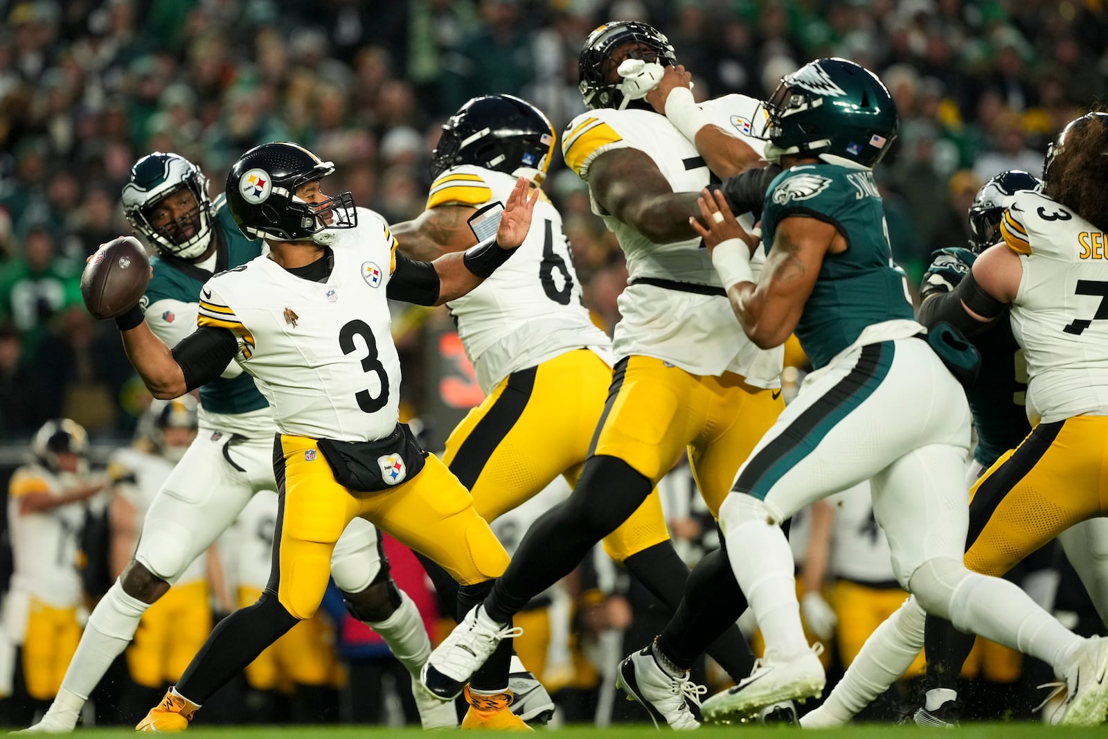 Pittsburgh Steelers quarterback Russell Wilson (3) looks to pass during the first half of an NFL football game against the Philadelphia Eagles on Sunday, Dec. 15, 2024, in Philadelphia. (AP Photo/Matt Slocum)