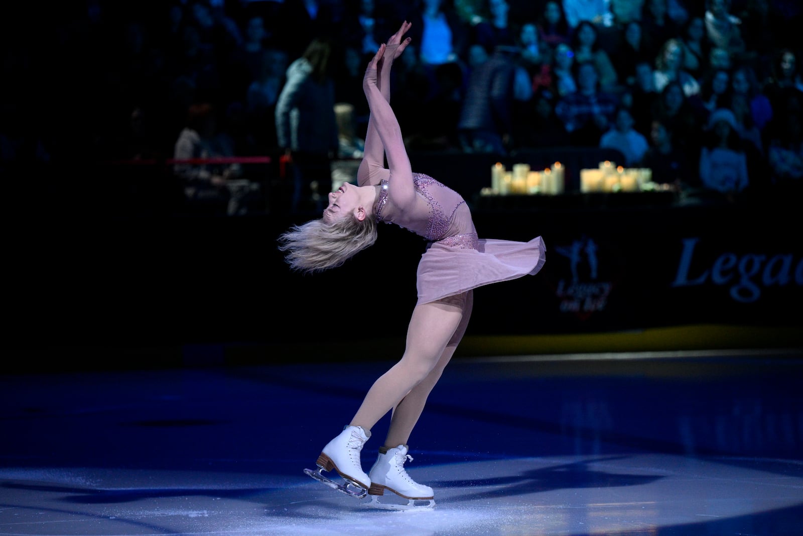 Amber Glenn performs Sunday, March 2, 2025, in Washington, at the Legacy on Ice event, a figure skating tribute to support the families and loved ones affected by the Jan. 29 aviation incident. (AP Photo/Nick Wass)