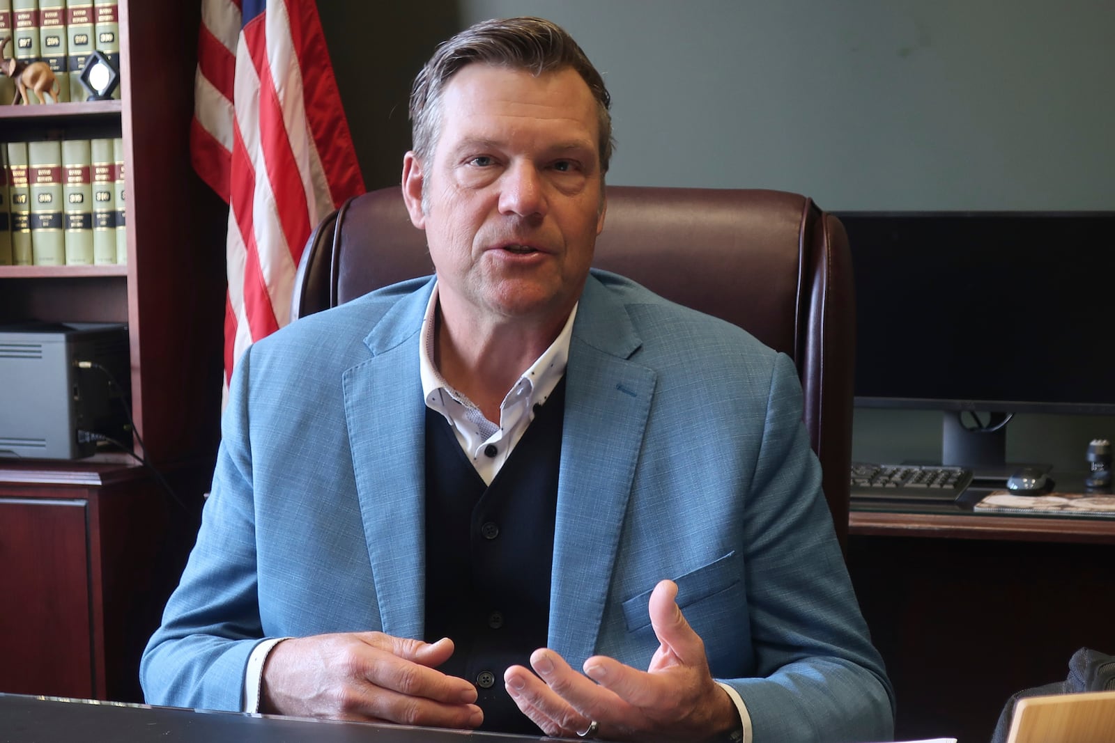 Kansas Attorney General Kris Kobach, a strong support of requiring new voters to provide proof of their U.S. citizenship when registering, answers questions during an interview with The Associated Press, Wednesday, Dec. 18, 2024, in his office in Topeka, Kan. (AP Photo/John Hanna)