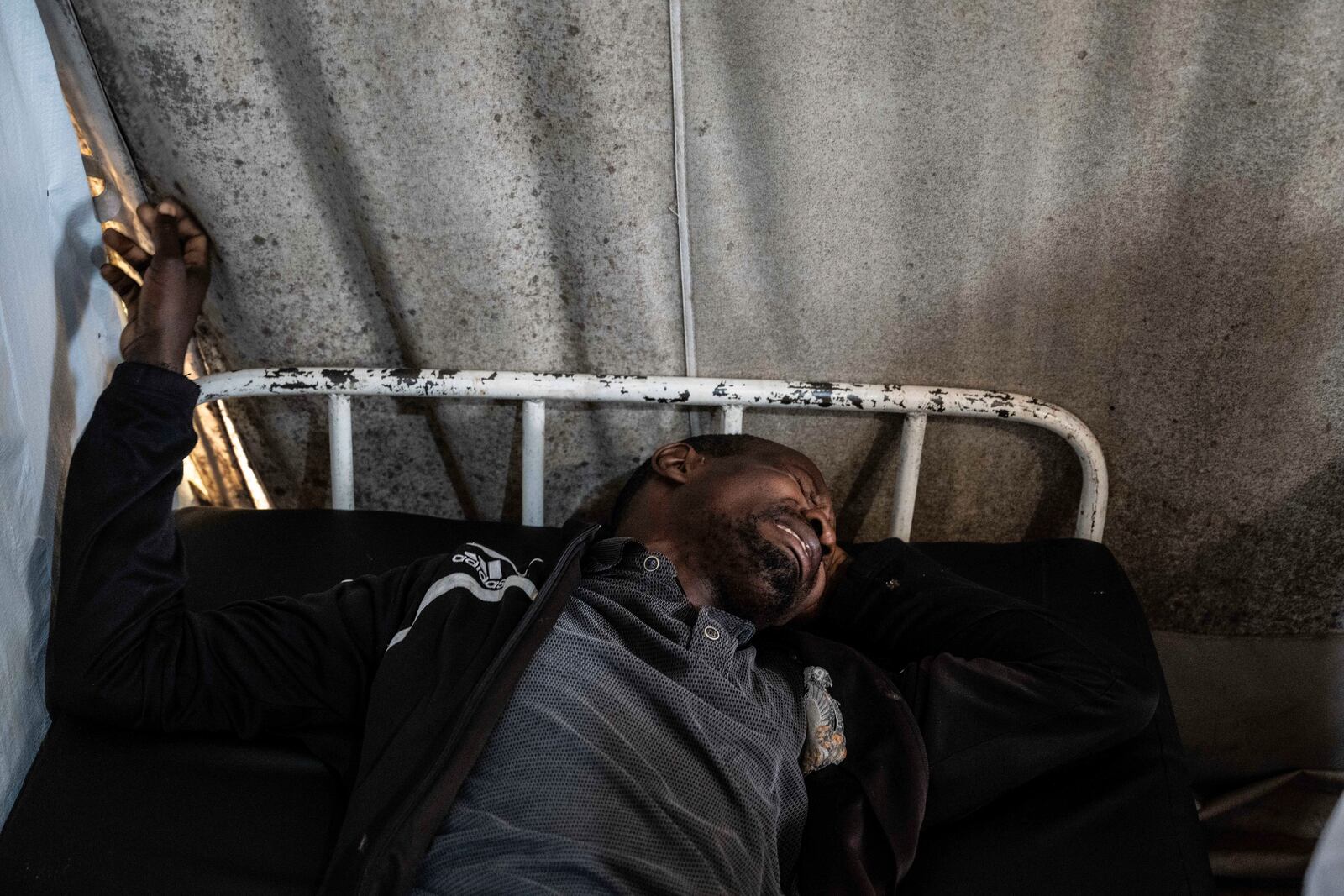 Medics treat a man wounded during fighting between Congolese government troops and M23 rebel forces in Goma's Kyeshero hospital Saturday, Feb. 1, 2025. (AP Photo/Moses Sawasawa)