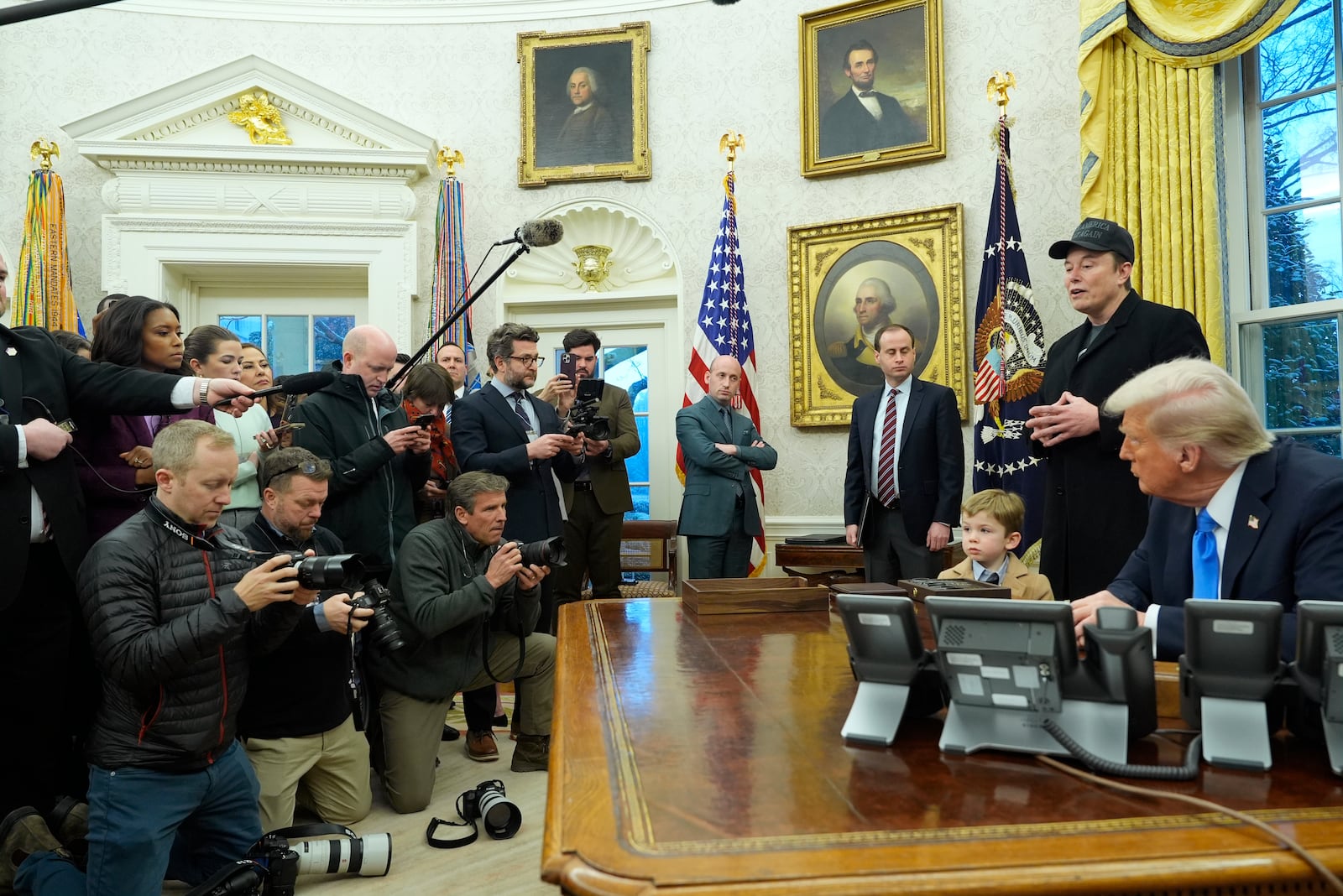 Elon Musk speaks during an event in the Oval Office as President Donald Trump and Musk's son X Æ A-Xii, listen at the White House, Tuesday, Feb. 11, 2025, in Washington. (Photo/Alex Brandon)