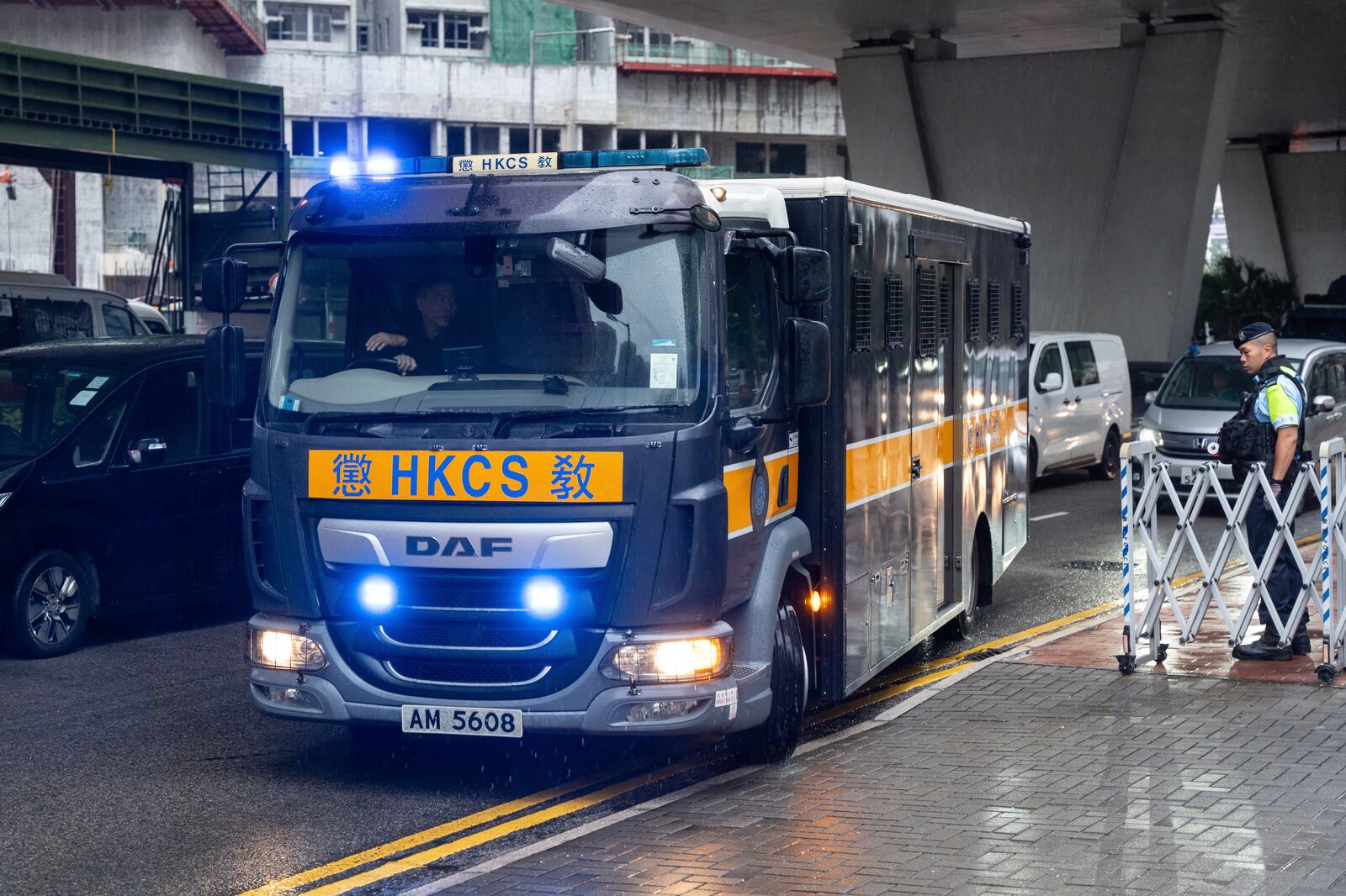 A Correctional Services Department vehicle arrives at the West Kowloon Magistrates' Courts in Hong Kong Tuesday, Nov. 19, 2024, ahead of the sentencing in national security case. (AP Photo/Chan Long Hei)