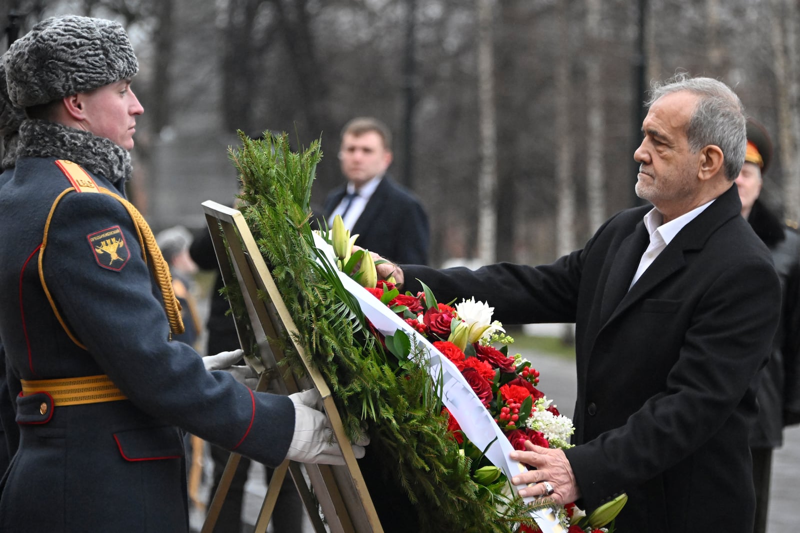 Iranian President Masoud Pezeshkian attends a laying of the wreath ceremony at the Unknown Soldier near the Kremlin Wall in Moscow, Russia, Friday, Jan. 17, 2025. (Alexander Nemenov/Pool Photo via AP)