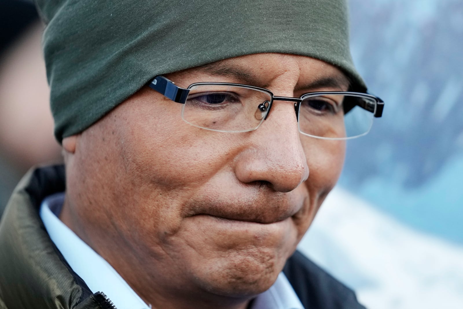 Peruvian farmer Luciano Lliuya arrives at the Higher Regional Court in Hamm, Germany, for a first hearing of his climate damages case against the German energy company RWE for its carbon emissions, which may have been contributing to the melting of a nearby glacier that could flood his home, Monday, March 17, 2025. (AP Photo/Martin Meissner)