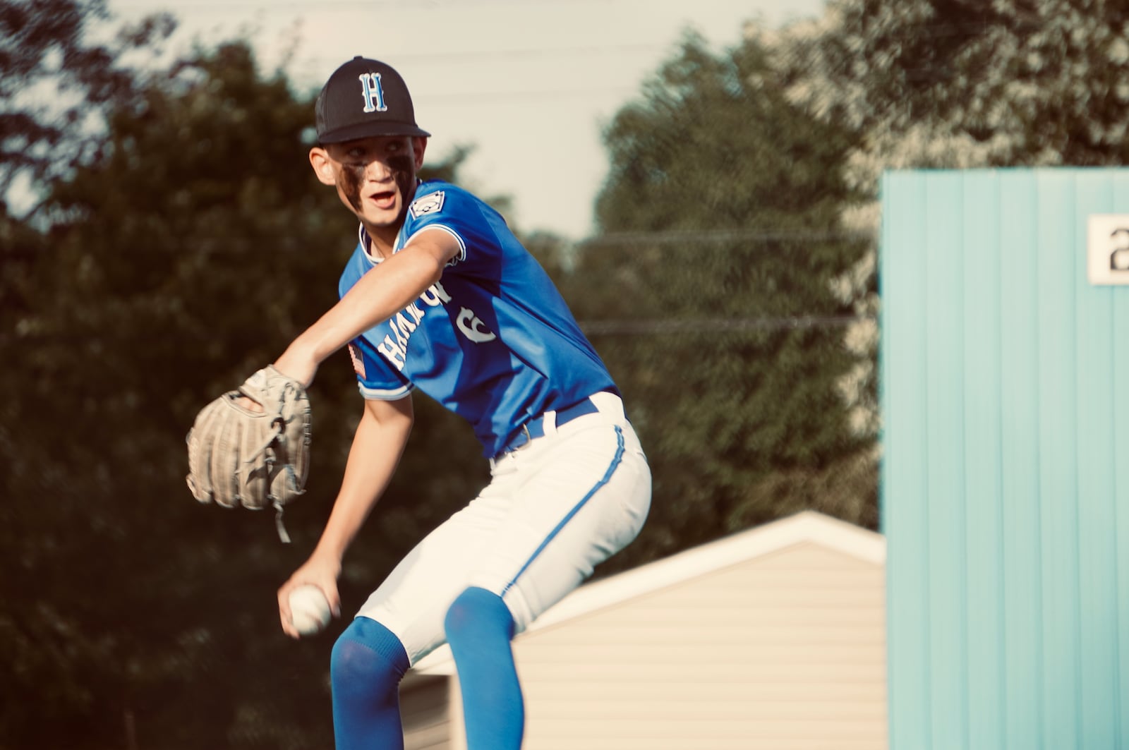 Hamilton West Side's Braydon Caudill (6) prepares to send a pitch to the plate against Anderson Township in the Ohio Little League District 9 tournament Monday night at West Side Little League. Chris Vogt/CONTRIBUTED