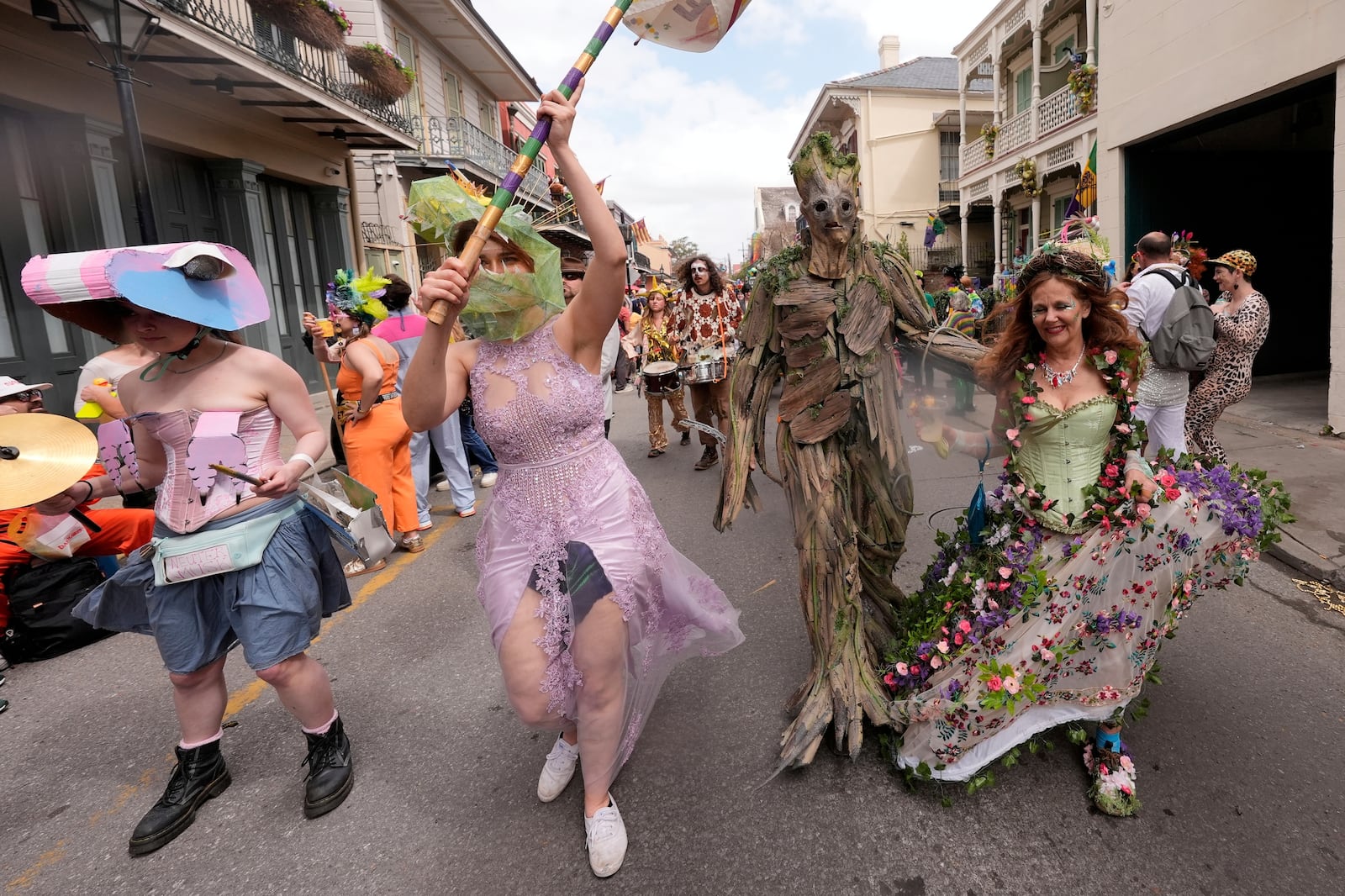 People have some fun during the Society of Saint Anne's parade on Mardi Gras Day, Tuesday, March 4, 2025 in New Orleans. (AP Photo/Gerald Herbert)