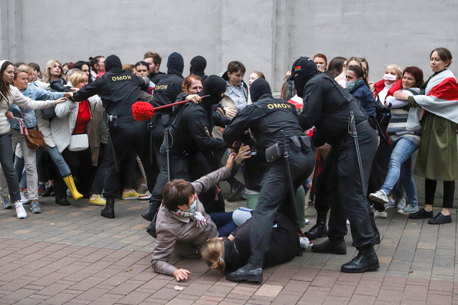 FILE - Police officers detain protesters during a rally in Minsk, Belarus, on Sept. 8, 2020, in support of opposition figure Maria Kolesnikova, to facilitate talks with President Alexander Lukashenko following a disputed presidential election the previous month. (AP Photo, File)