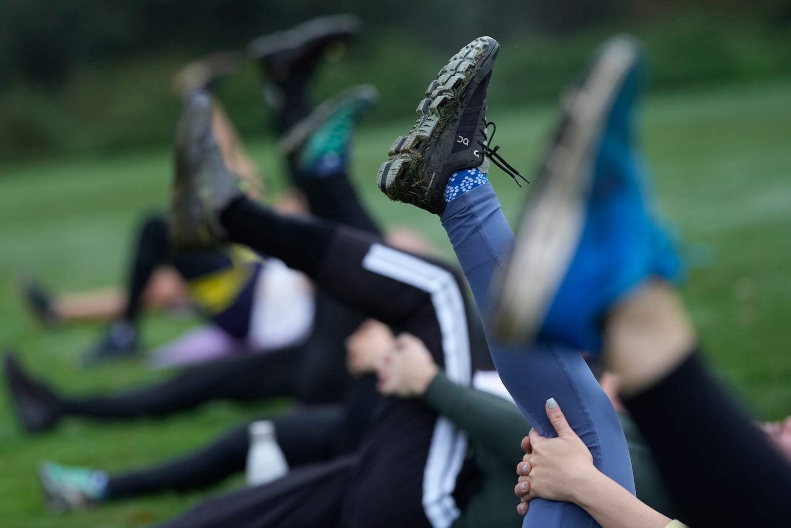 A participants takes part in an outdoor gym class led by personal fitness trainer Richard Lamb, during an outdoor gym class in London, Saturday, Oct. 26, 2024. (AP Photo/Alastair Grant)