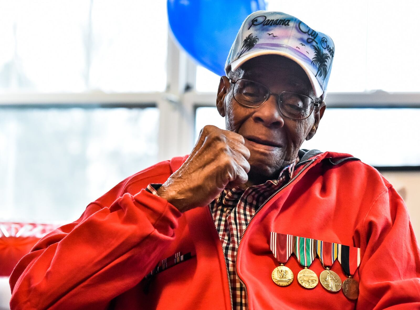 World War II veteran William “Jimmy” Phillips gives a fist pump after receiving his long awaited war medals during a ceremony Thursday, Feb. 22 at Woodlands of Middletown Assisted Living facility. Phillips, who turns 92 next month, has waited nearly 70 years since his discharge to receive his medals. He was awarded the Army Good Conduct Medal, Europe-Africa Middle Eastern Campaign Medal, World War II Victory Medal and the Army of Occupation Medal during the ceremony. Jerry Ferris and Randy Howson with the Military Order of the Purple Heart Chapter 31 presented the medals. NICK GRAHAM/STAFF