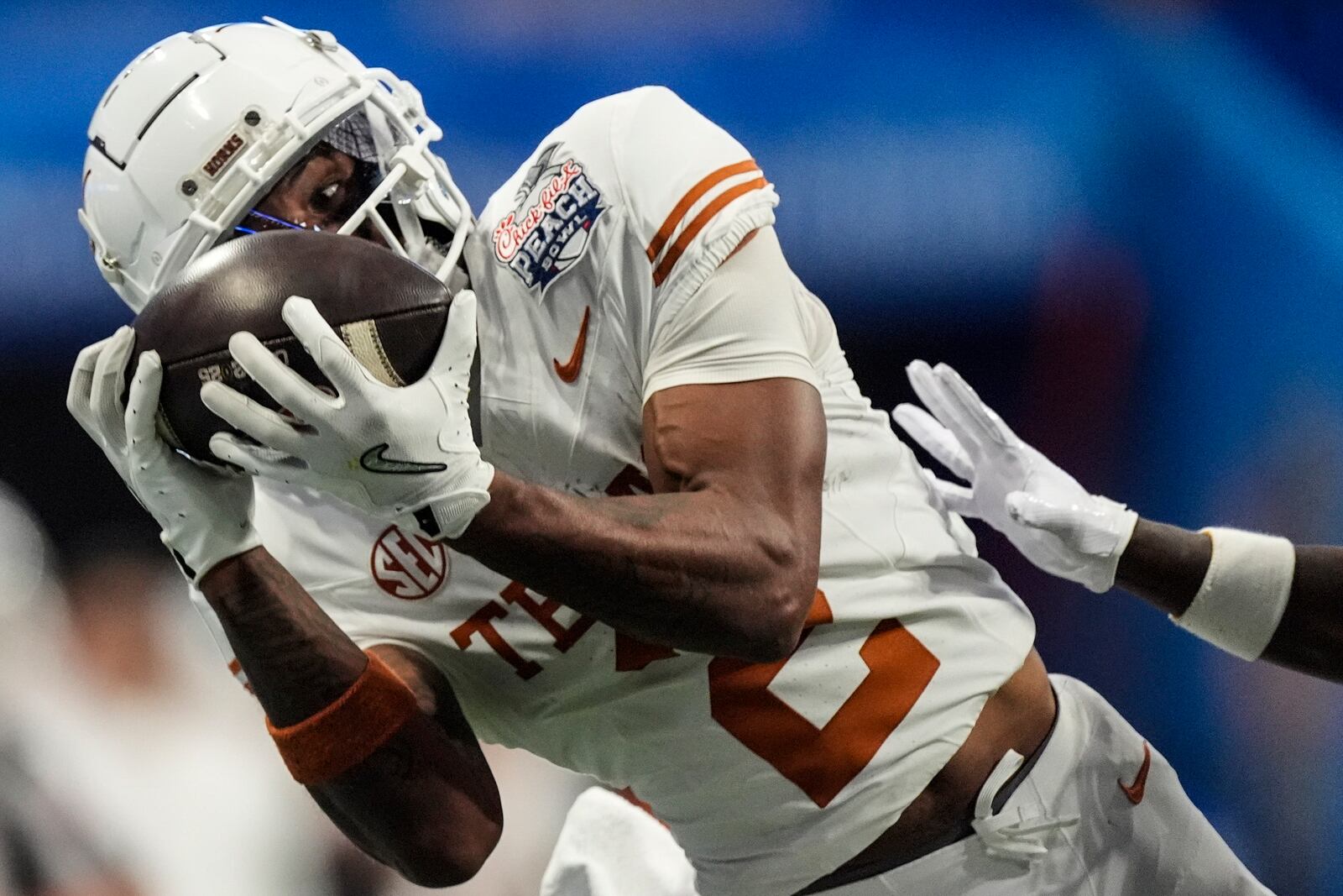 Texas wide receiver Matthew Golden (2) makes the catch against Arizona State during overtime in the quarterfinals of a College Football Playoff game, Wednesday, Jan. 1, 2025, in Atlanta. Texas won 39-31 in two overtime periods. (AP Photo/John Bazemore)