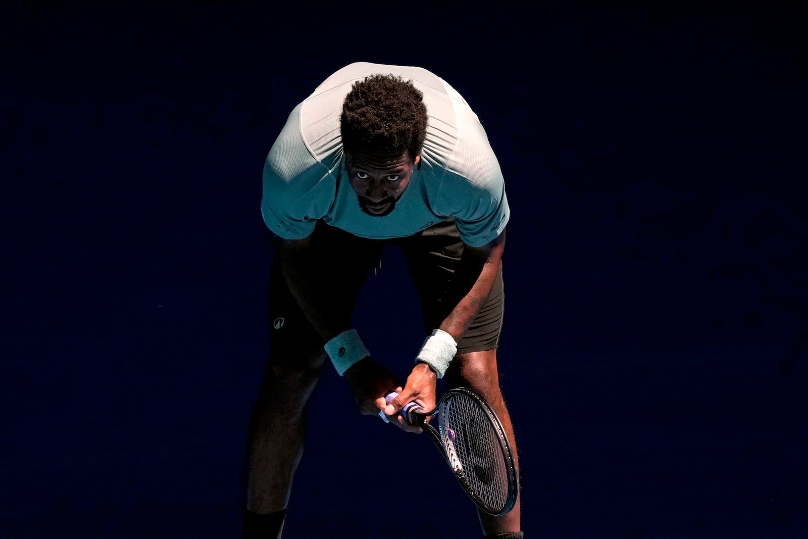 Gael Monfils of France waits to receive serve from Taylor Fritz of the U.S. during their third round match at the Australian Open tennis championship in Melbourne, Australia, Saturday, Jan. 18, 2025. (AP Photo/Manish Swarup)