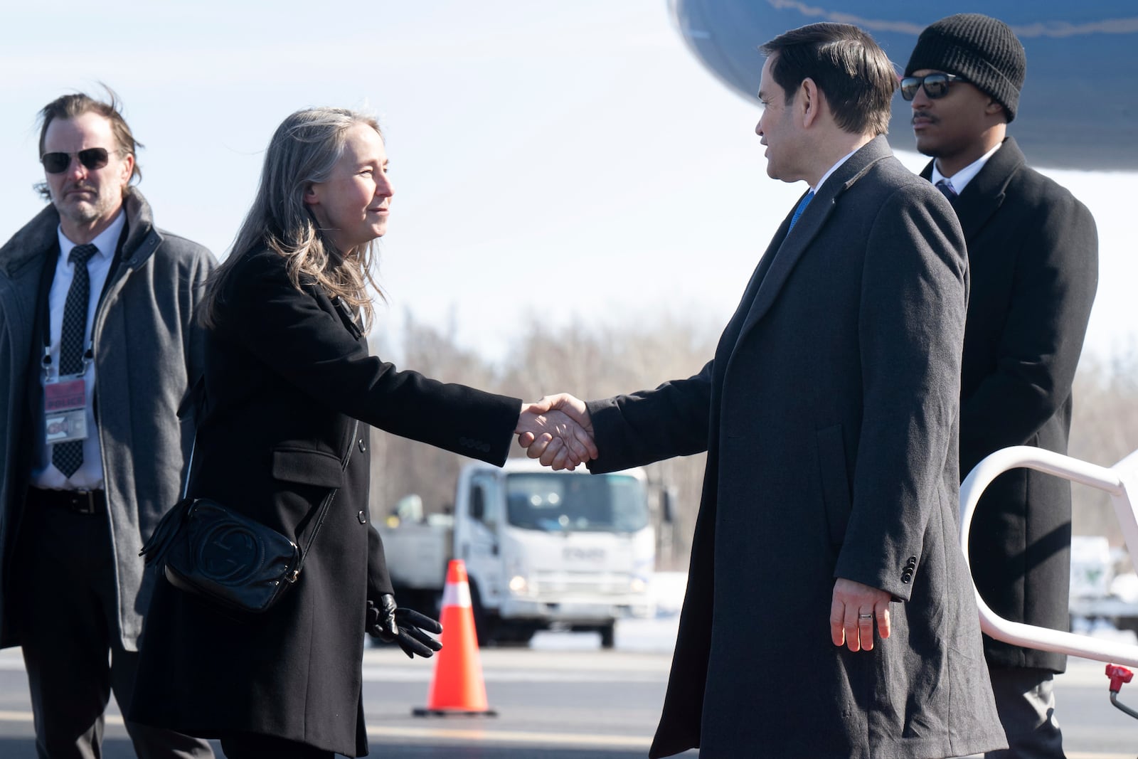 Canadian Deputy Director of Protocol and Liaison Lena Tobin greets U.S. Secretary of State Marco Rubio as he disembarks from a military airplane upon arrival at Quebec City Jean Lesage International Airport in Quebec, Canada, March 12, 2025, as he travels to a G7 Foreign Ministers meeting. (Saul Loeb/Pool Photo via AP)