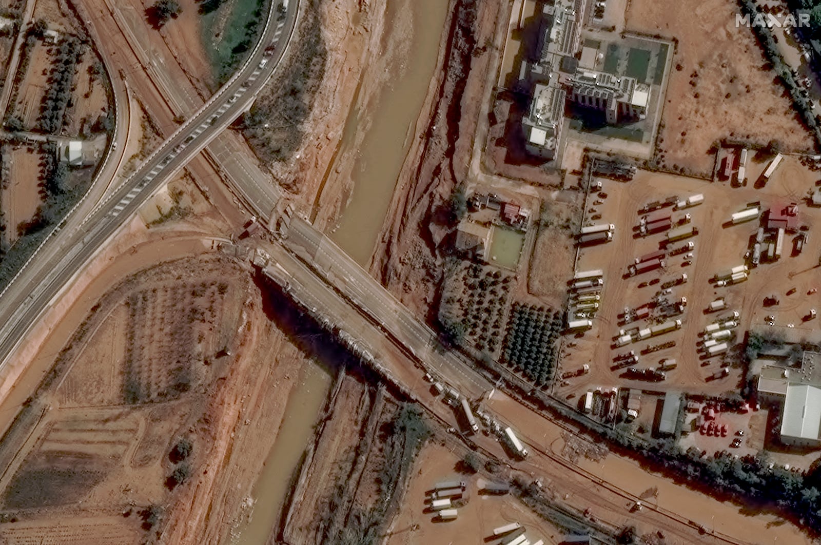 This satellite image released by Maxar Technologies shows mud and a damaged highway caused by floods in Valencia, Spain, Thursday Oct. 31, 2024. (Satellite image ©2024 Maxar Technologies via AP)