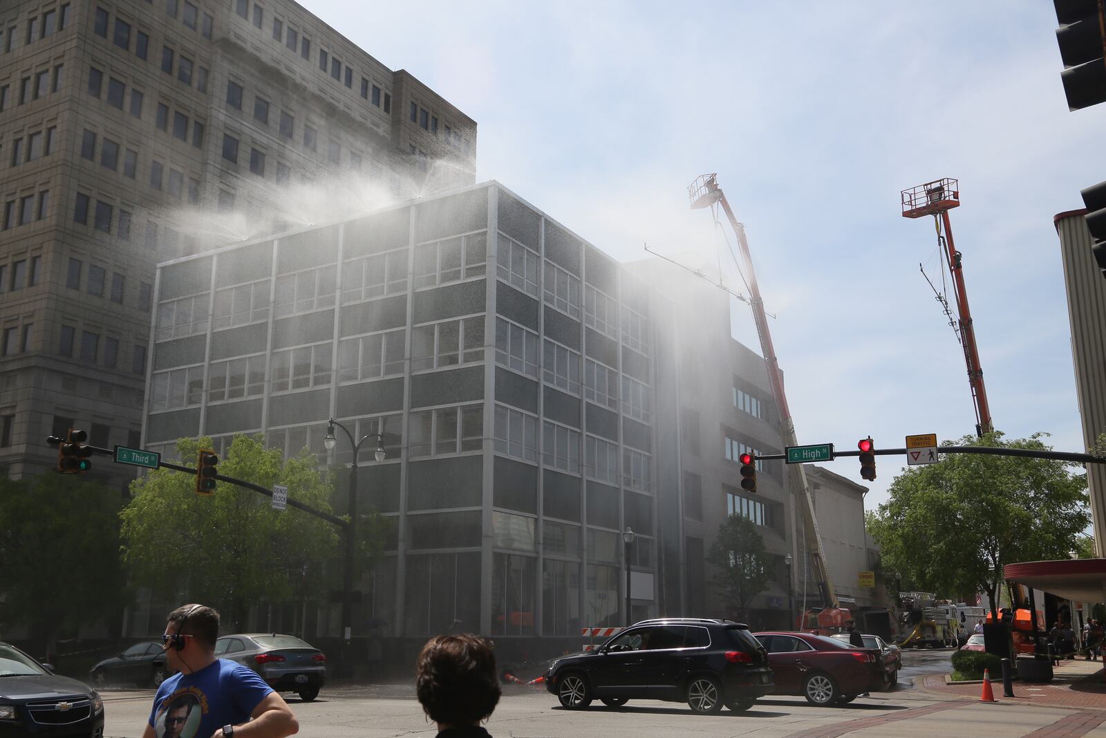 "Rain" falls off the former Fifth Third building in downtown Hamilton on April 26. The rain was a special effect for “The Old Man and the Gun,” a movie being produced by and starring Robert Redford that is filming scenes in downtown Hamilton.