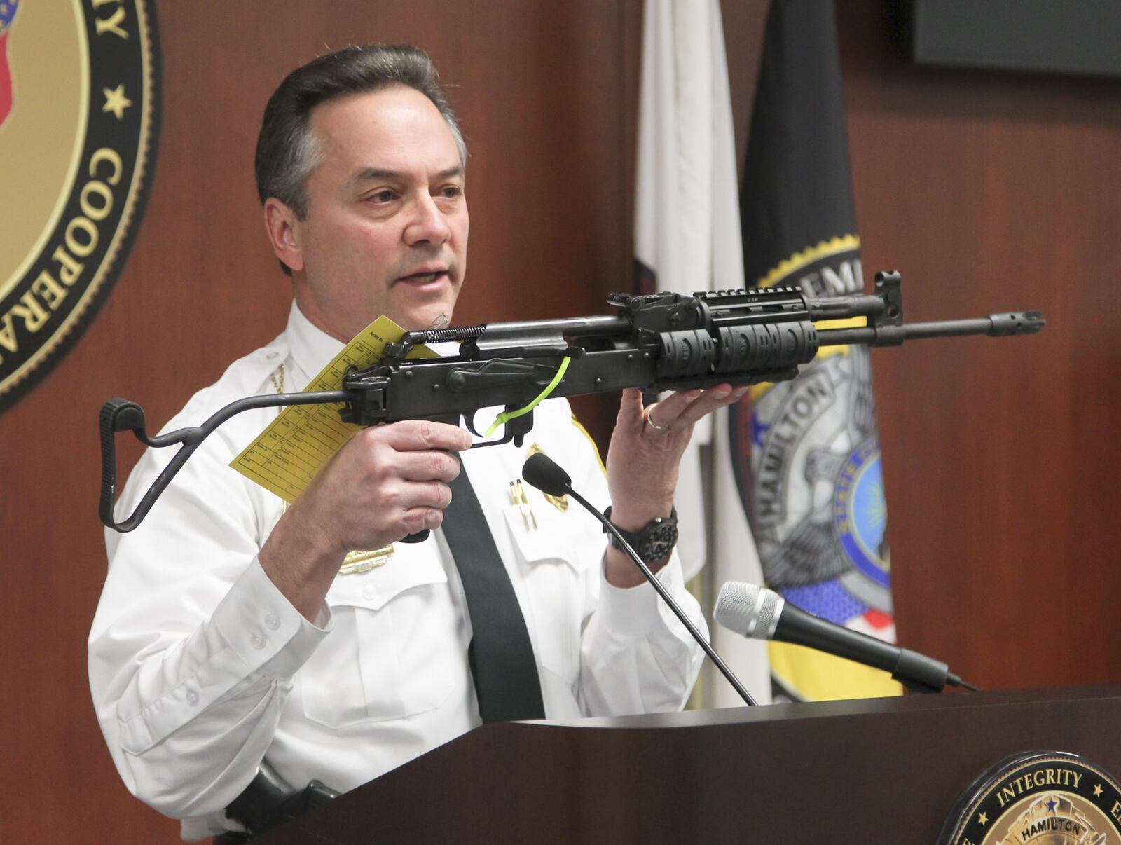 Hamilton Chief of Police Scott Scrimizzi with the civilian model AK-47 rifle used in the officer involved shooting that occurred in Hamilton on Feb. 15, injuring officer Chad Stafford.