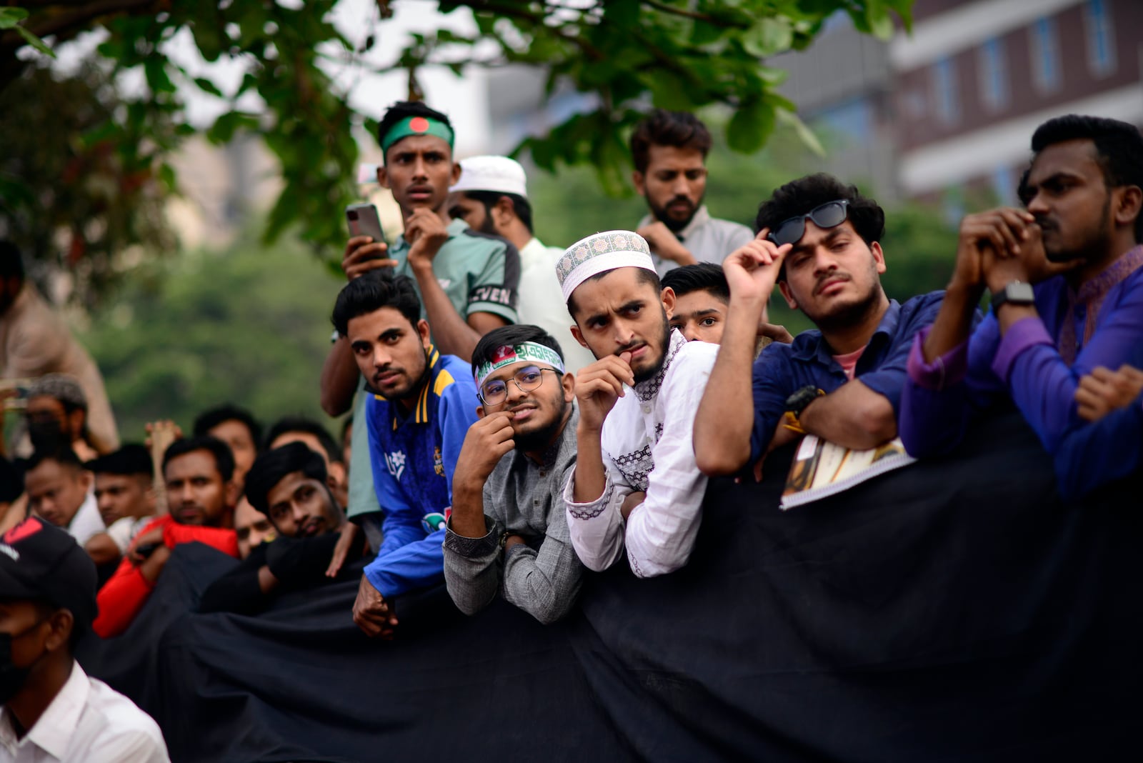 Students listen to their leader during the launch of their new political party called the Jatiya Nagarik Party, or National Citizen Party in Dhaka, Bangladesh, Friday, Feb. 28, 2025. (AP Photo/Mahmud Hossain Opu)