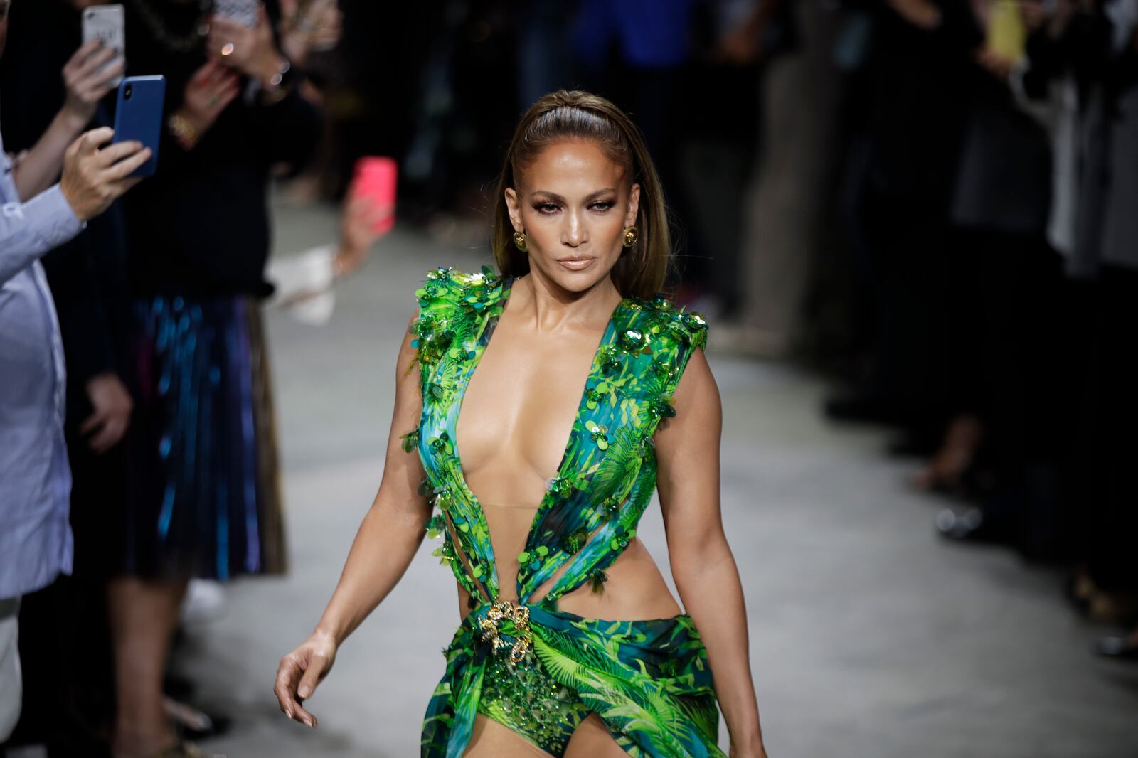 FILE - Actress Jennifer Lopez wears a creation as part of the Versace Spring-Summer 2020 collection, unveiled during the fashion week, in Milan, Italy, Friday, Sept. 20, 2019. (AP Photo/Luca Bruno, File)