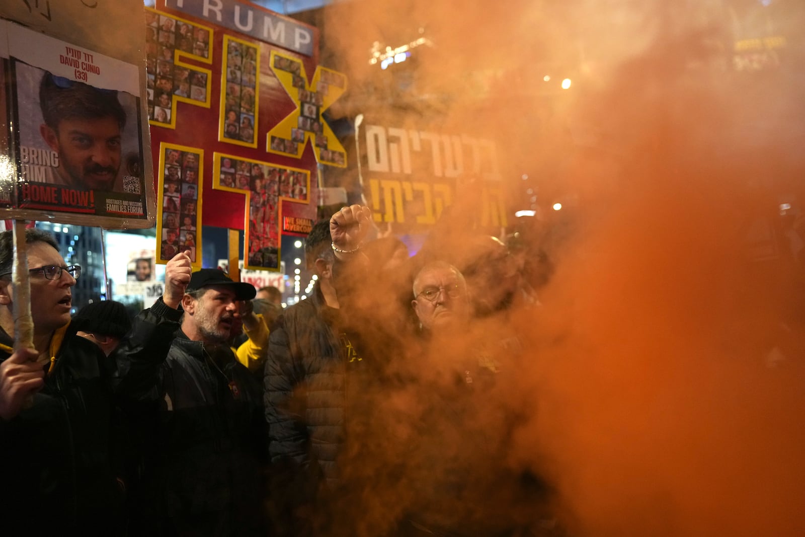 Relatives of hostages, held by Hamas in the Gaza Strip, protest in Tel Aviv, Monday, Feb. 10, 2025 after the militant group announced it would delay hostage releases in the Gaza Strip after accusing Israel of violating a fragile ceasefire. (AP Photo/Ohad Zwigenberg)