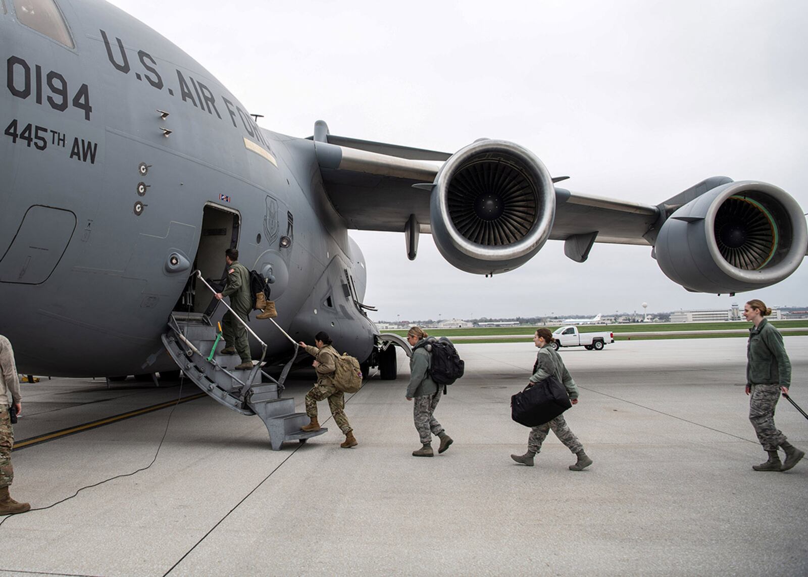 A doctor and several nurses from the 445th Airlift Wing’s Aerospace Medicine and Aeromedical Staging Squadrons board a C-17 Globemaster III at Wright-Patterson Air Force Base April 5, heading to Joint Base McGuire-Dix-Lakehurst, New Jersey. The Airmen were notified April 4 that they would be mobilized to New York City to help with the COVID-19 pandemic. They showed up for deployment within 24 hours. U.S. AIR FORCE PHOTO/PATRICK O’REILLY