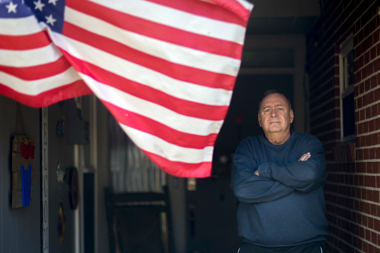 Retired U.S. Marine Stephen Watson stands on the front porch of his home, Monday, March 3, 2025, in Jesup, Ga. (Photo/Stephen B. Morton)