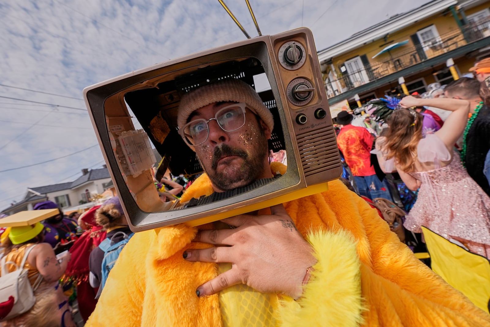 Tony Burgesen has some fun during the Society of Saint Anne's parade on Mardi Gras Day, Tuesday, March 4, 2025 in New Orleans. (AP Photo/Gerald Herbert)