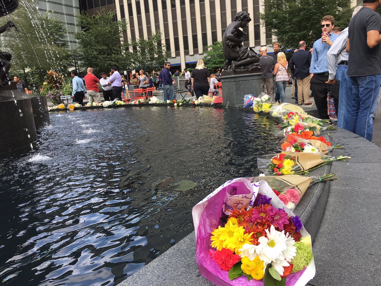 Photos: Locals honor three killed day after Fountain Square shooting