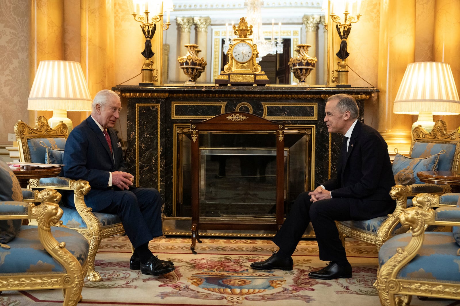 King Charles III, left, holds an audience with Canada's Prime Minister Mark Carney, right, at Buckingham Palace in London, England, Monday, March 17, 2025. (Aaron Chown/PA via AP, Pool)