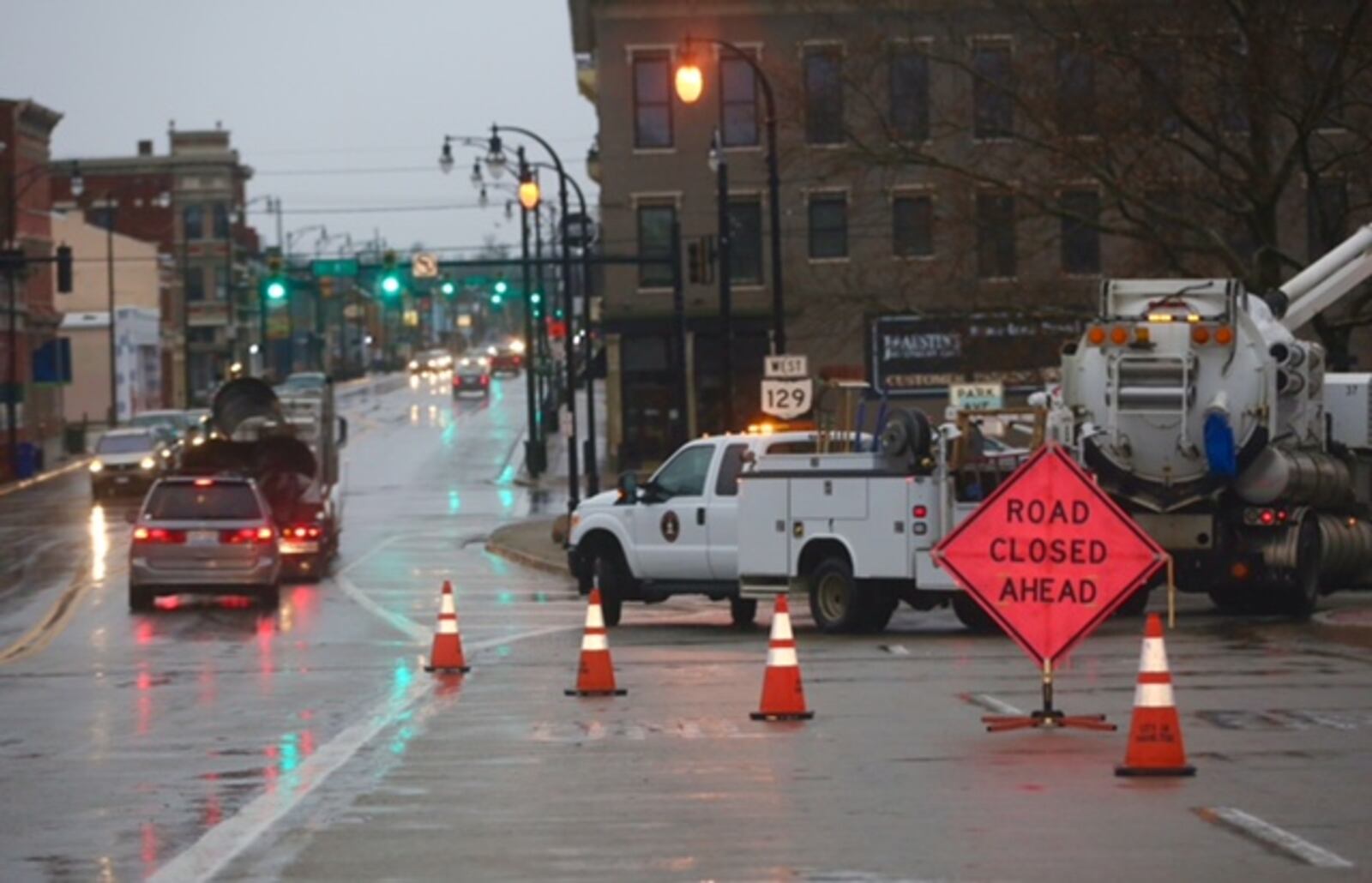 Crews clear leaves from storm drains to alleviate flooding March 1 at the Park Avenue ramp off the High Main Bridge in Hamilton. 