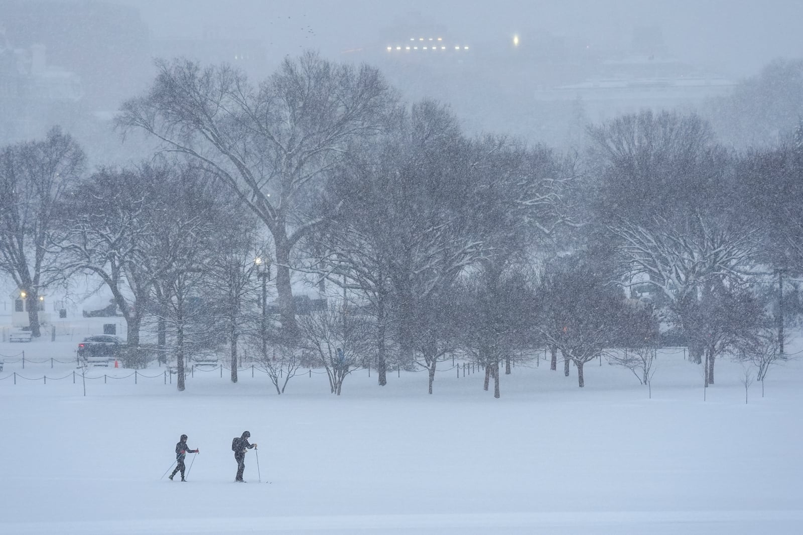 People ski during a winter snow storm in Washington, Monday, Jan. 6, 2025. (AP Photo/Matt Rourke)