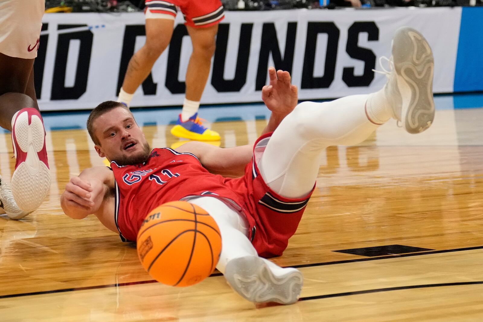 Saint Mary's center Mitchell Saxen (11) loses the ball in the second half of game against Alabama in the second round of the NCAA college basketball tournament, Sunday, March 23, 2025, in Cleveland. (AP Photo/Sue Ogrocki)