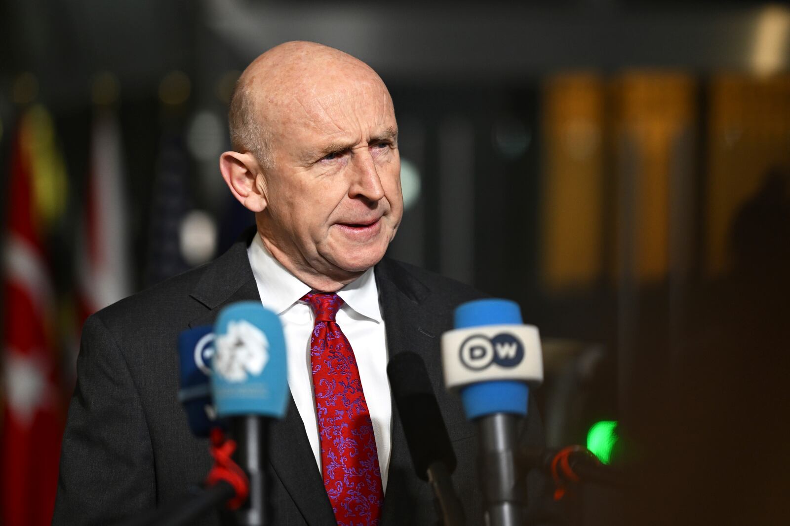 Britain's Defense Secretary John Healey speaks with the media as he arrives for a meeting of NATO defense ministers at NATO headquarters in Brussels, Thursday, Feb. 13, 2025. (AP Photo/Harry Nakos)