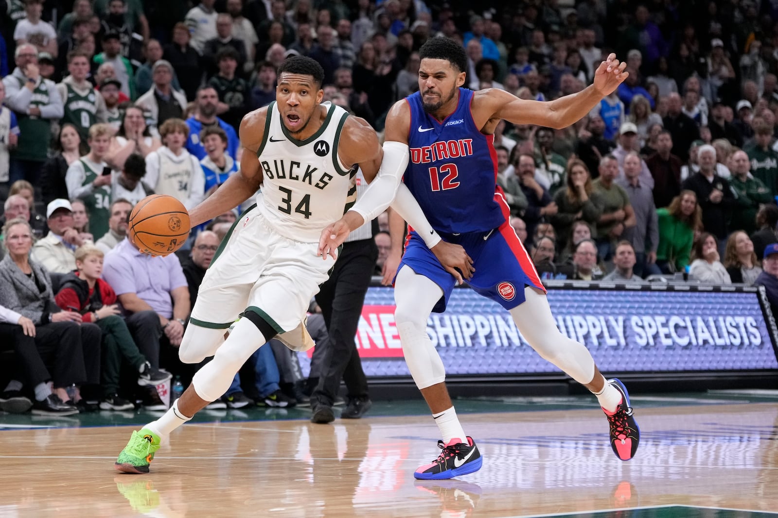 Milwaukee Bucks' Giannis Antetokounmpo gets past Detroit Pistons' Tobias Harris during the second half of an NBA basketball game Wednesday, Nov. 13, 2024, in Milwaukee. (AP Photo/Morry Gash)