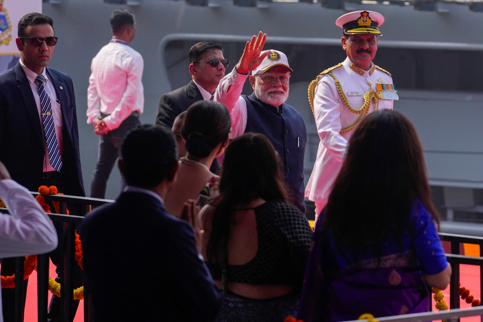 Indian Prime Minister Narendra Modi greets after the commissioning of INS Surat at a naval dockyard in Mumbai,, India, Wednesday, Jan. 15, 2025. (AP Photo/Rafiq Maqbool)