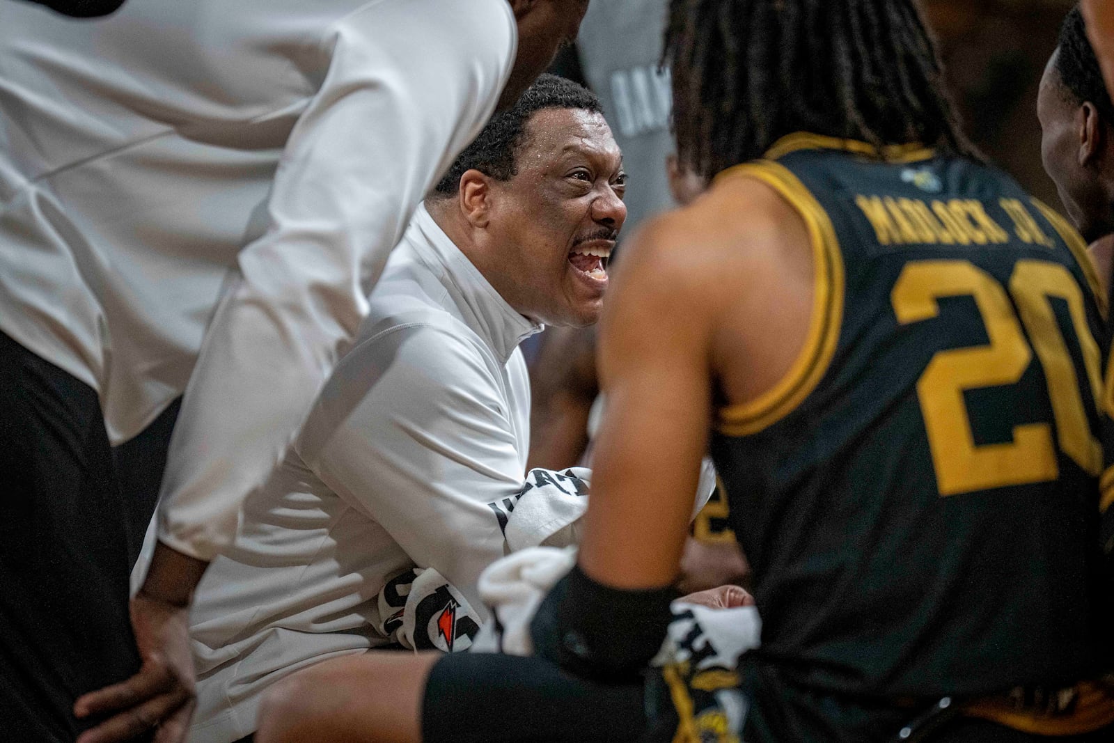 Alabama State head coach Tony Madlock talks with his team during the second half of an NCAA basketball game in the championship of the Southwest Athletic Conference Championship tournament against Jackson State Saturday, March 15, 2025, in College Park, Ga. (AP Photo/Erik Rank)