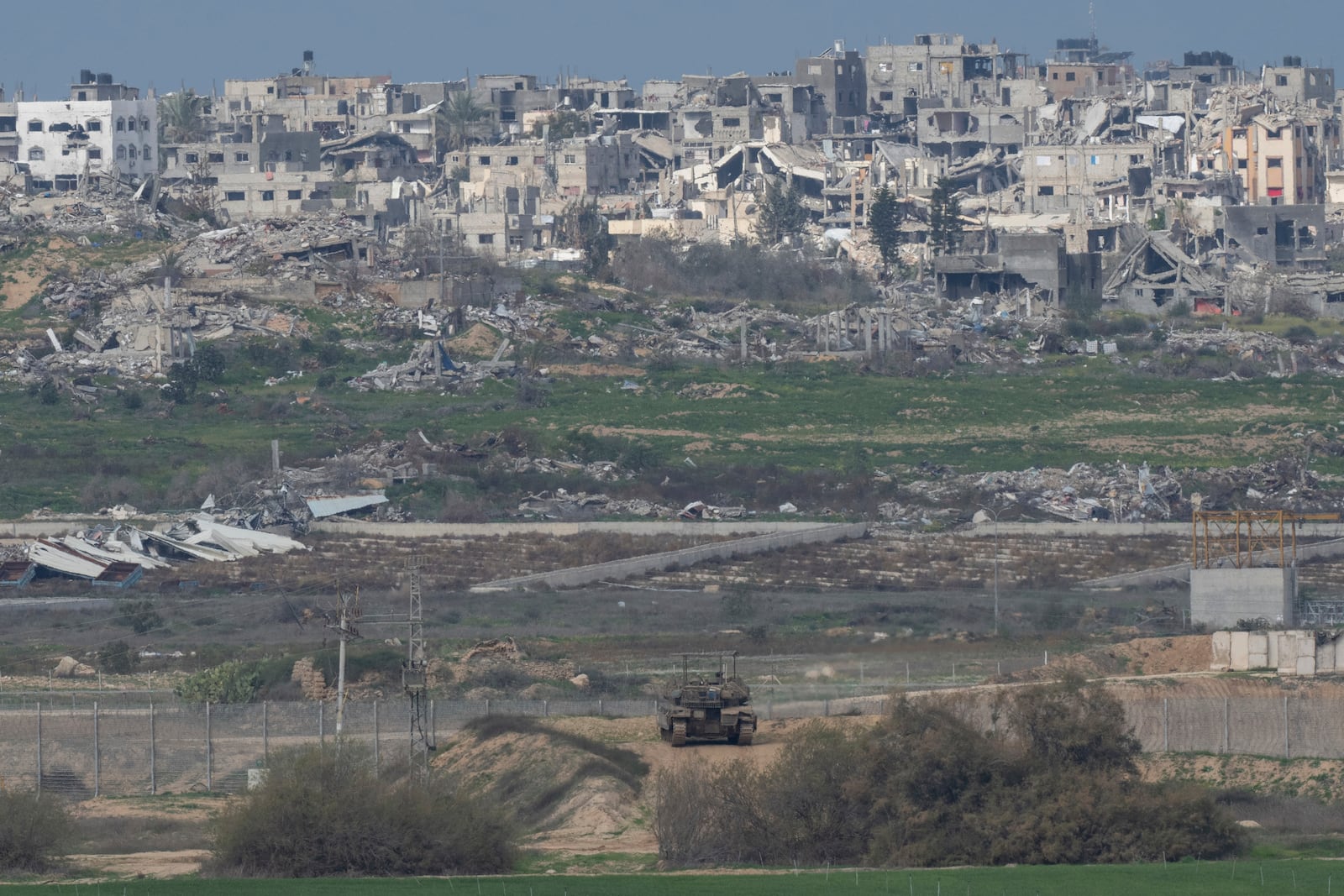 An Israeli tank takes a position near the border with Gaza in southern Israel, Sunday, Feb. 9, 2025. (AP Photo/Ohad Zwigenberg)