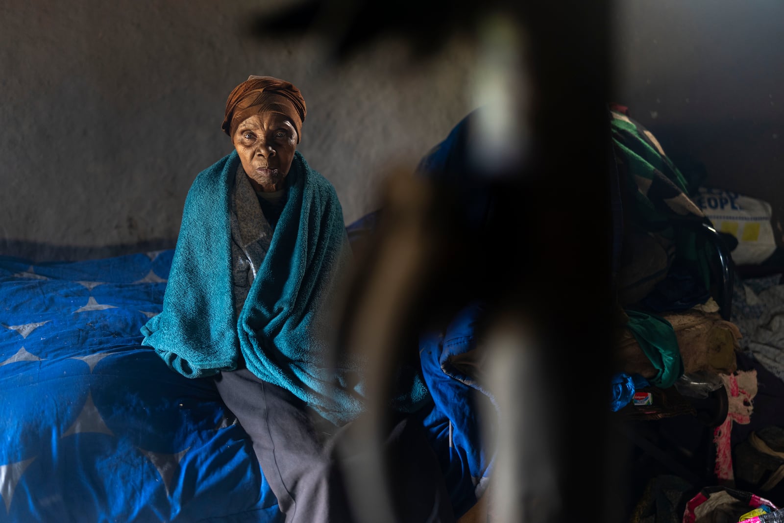 Nozuko Majola's grand mother sits in her Umzimkhulu home Tuesday, Nov. 11, 2025, affected by U.S. President Donald Trump's global foreign aid freeze, raising worries about HIV patients defaulting on treatment. (AP Photo/Jerome Delay)