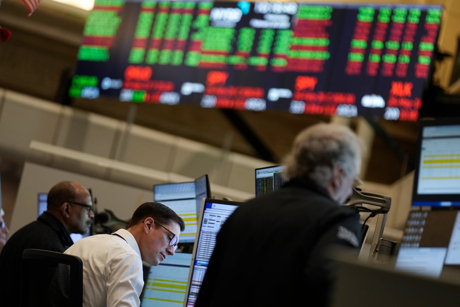 People work on the options floor at the New York Stock Exchange in New York, Wednesday, Feb. 26, 2025. (AP Photo/Seth Wenig)